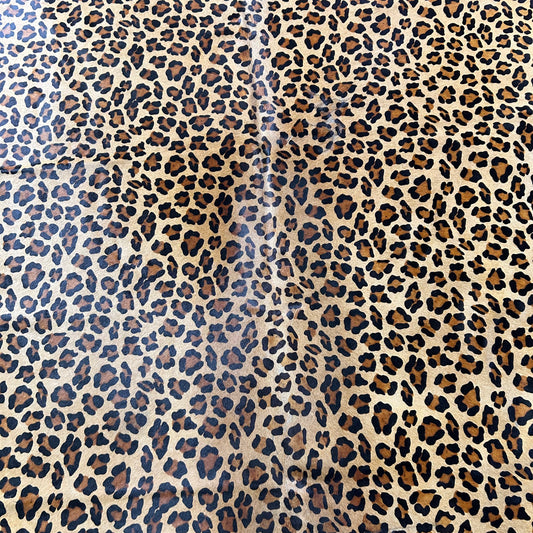 Leopard Print Cowhide Rug (shape is a bit jagged at the bottom) Size: 7x6.5 feet Z-358
