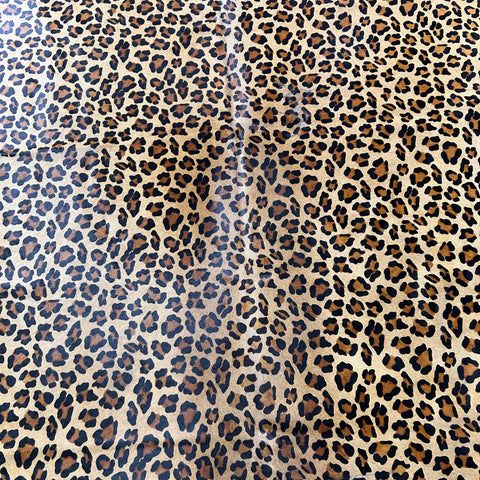 Leopard Print Cowhide Rug (shape is a bit jagged at the bottom) Size: 7x6.5 feet Z-358