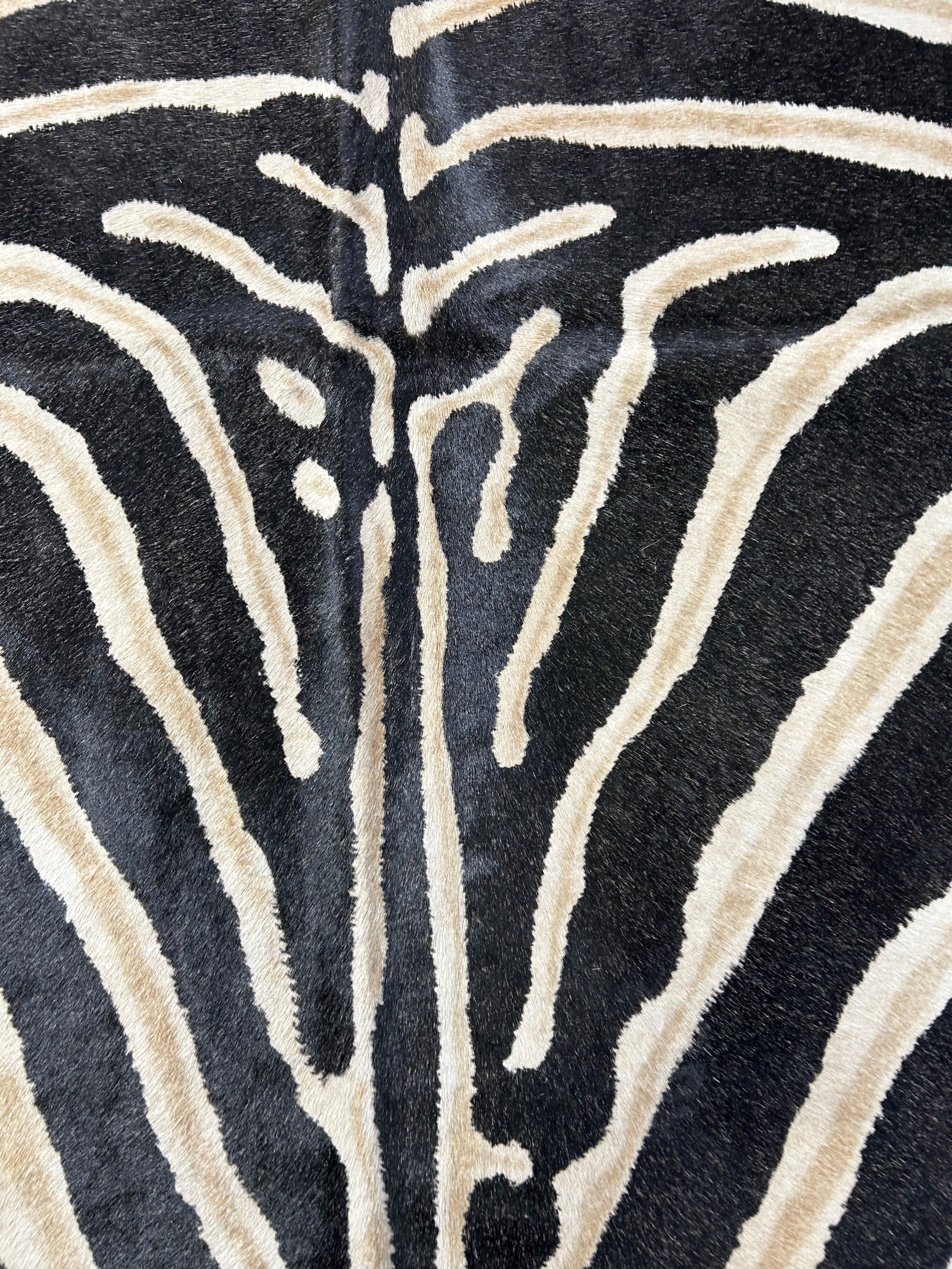 Genuine Zebra Print Cowhide Rug (inner stripes are light brown/black stripes are faded) Size: 7x5.5 feet D-099