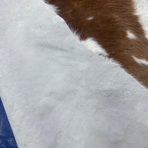 Brown and White Calf Skin (longish hair/ some bald spots) Size: 42x37" X-003