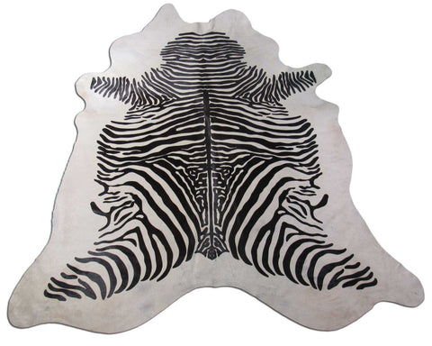 Zebra Print Cowhide Rug (light background but a few specs) Size: 7 1/4x6 3/4 feet C-1584