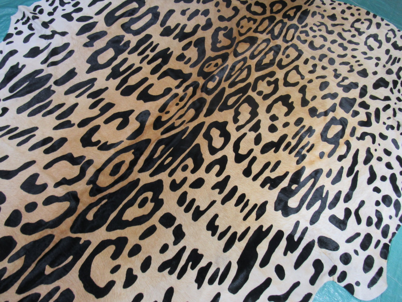 Jaguar Print Cowhide Rug (has a part that looks like a stain/ fire brand) Size: 7x6.2 feet C-1661