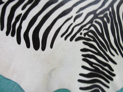 Zebra Print Cowhide Rug (light background but a few specs) Size: 7 1/4x6 3/4 feet C-1584