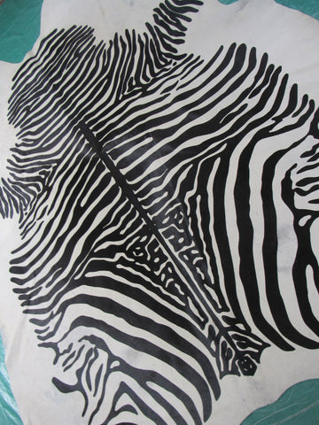 Zebra Cowhide Rug (bald spot and a few imperfections) Size: 7 1/4x6 3/4 feet C-1611